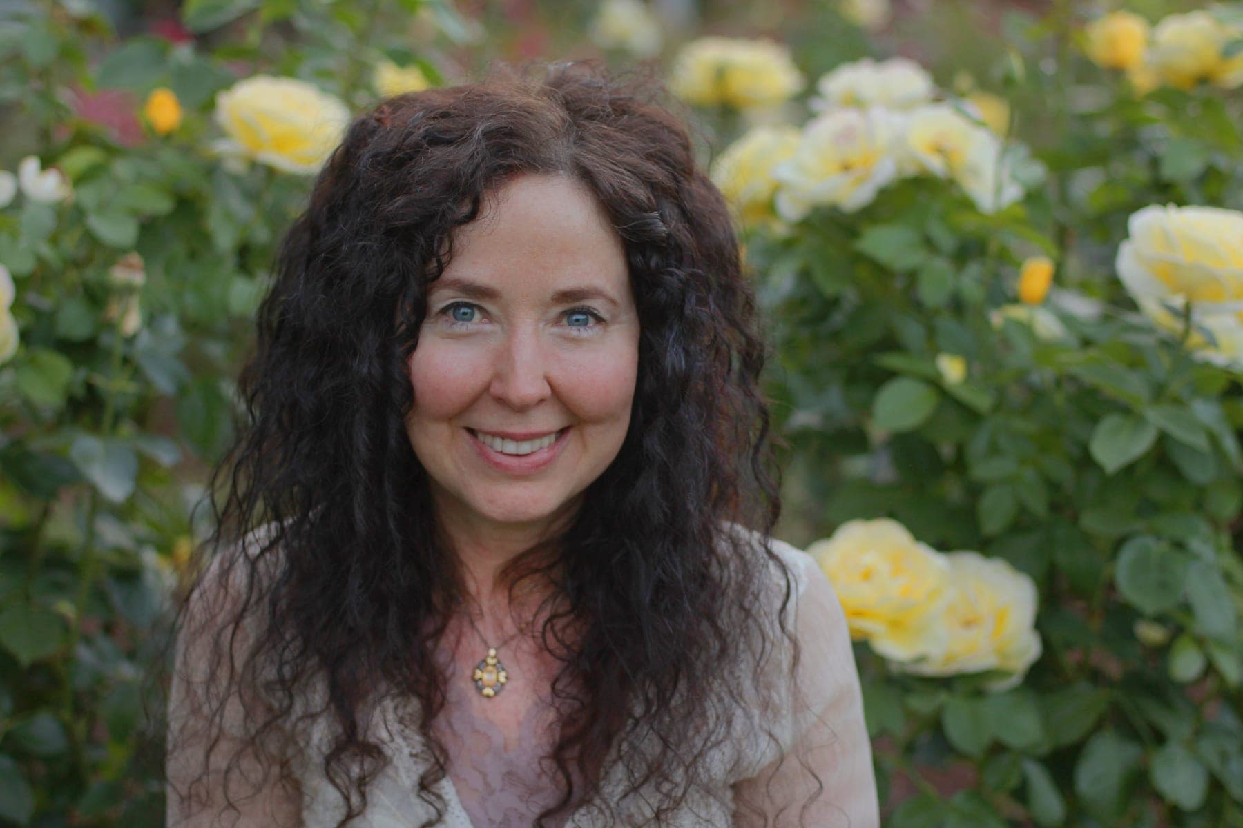 Susan Hiera Bass, founder of Sarasvati Ayurveda Institute, in a rose garden